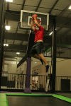 Man Doing Two Handed Sideways Dunk